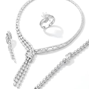 A Sophisticated 925 Sterling Silver Jewelry Set for Women featuring a Tassel-style Necklace with Triple Rows of Zirconia, a Matching Wave Bracelet, Ribbon-design Ring, and Long Dangle Earrings