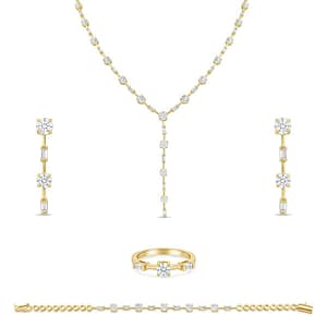 A Sophisticated Gold Plated Women's Jewelry Set featuring a Y-shaped Necklace, a Thin Bracelet, Dangle Earrings, and a Ring, all set with Round and Baguette-cut Cubic Zirconia