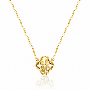 A high-quality 18k gold-plated 925 sterling silver necklace featuring a delicate four-leaf clover pendant. The clover charm has a sunburst-textured finish with a beaded gold border, suspended on a fine link gold chain against a clean white background